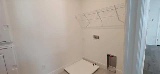 a bathroom with a granite countertop bathtub shower sink vanity and toilet