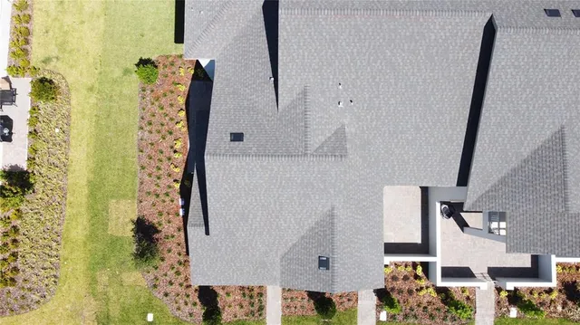 a view of a house with a plants and a potted plant