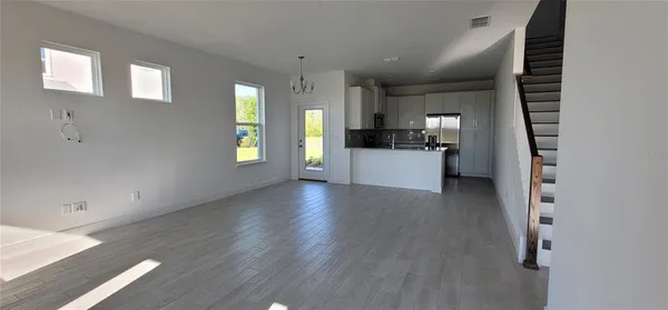 a view of a kitchen with a sink and a window