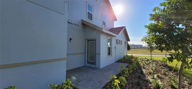 a view of a house with a backyard