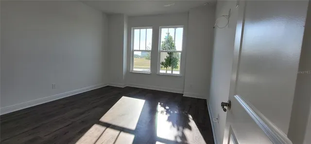 a view of an empty room and window