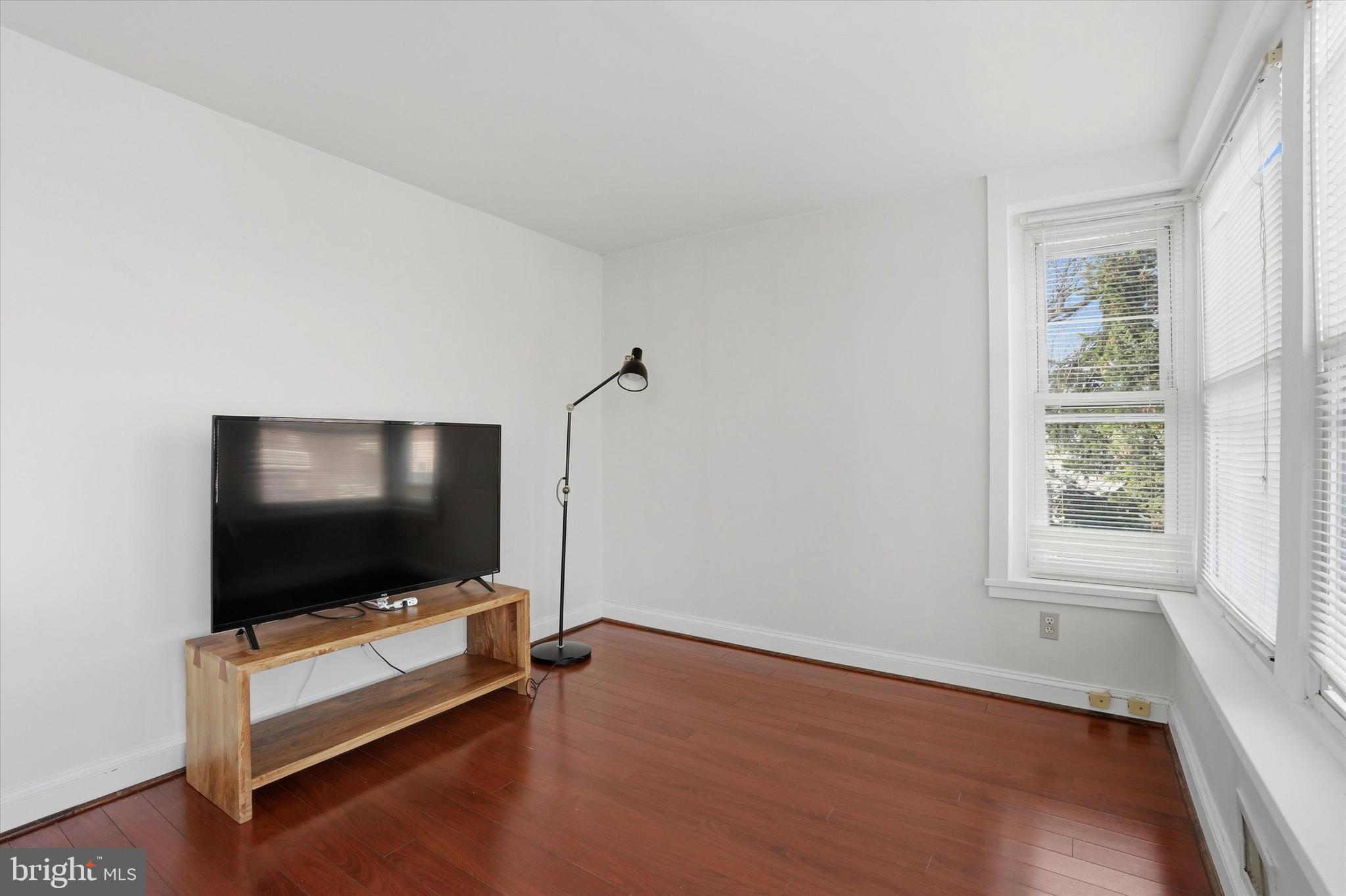 1713 Green Street, Unit 5 Philadelphia, PA 19130 - Photo 12 of 15 a living room with furniture and a flat screen tv