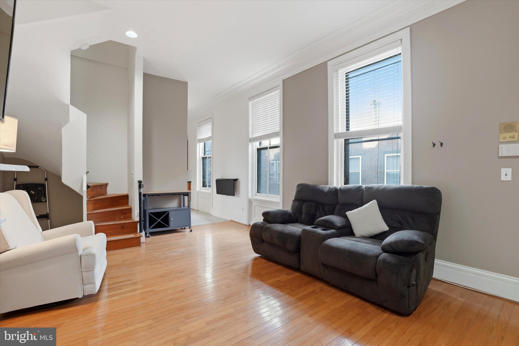 1713 Green Street, Unit 5 Philadelphia, PA 19130 - Photo 2 of 15 a living room with furniture window and wooden floor