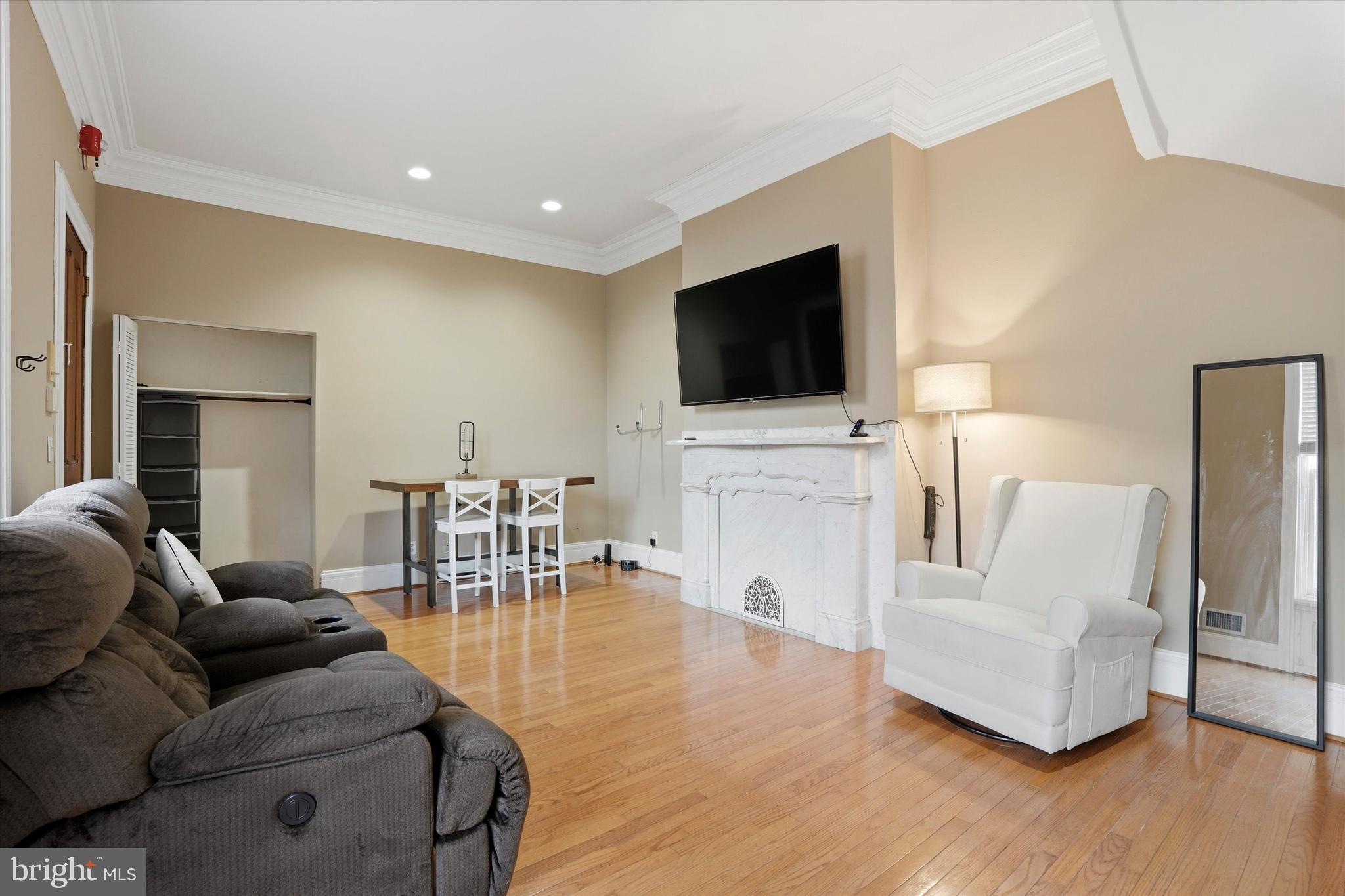1713 Green Street, Unit 5 Philadelphia, PA 19130 - Photo 4 of 15 a living room with furniture and a flat screen tv