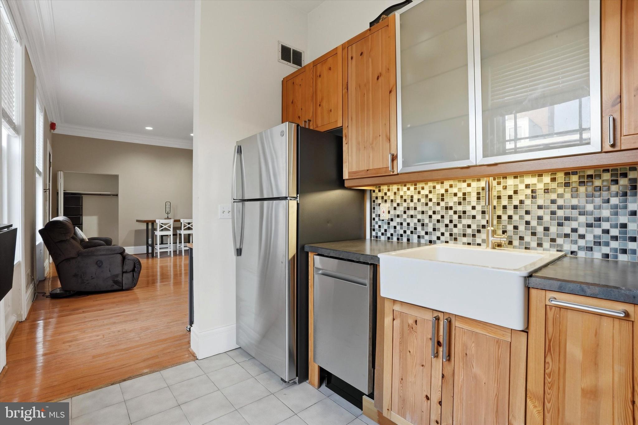 1713 Green Street, Unit 5 Philadelphia, PA 19130 - Photo 7 of 15 a kitchen with a refrigerator and a sink