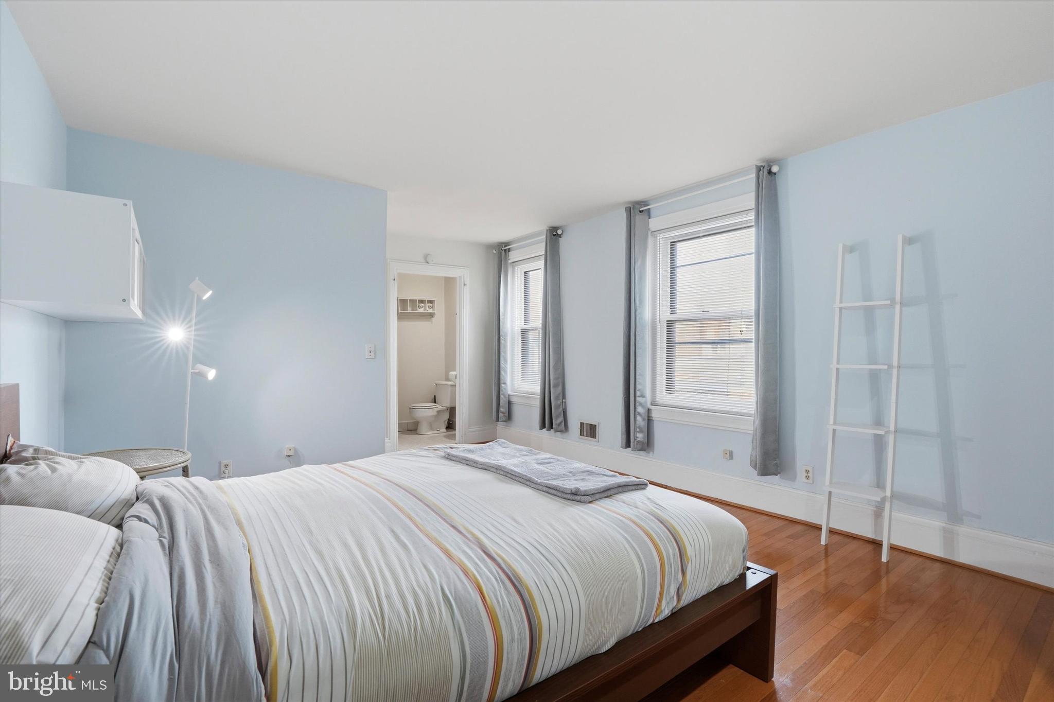 1713 Green Street, Unit 5 Philadelphia, PA 19130 - Photo 9 of 15 a bedroom with a bed and a window