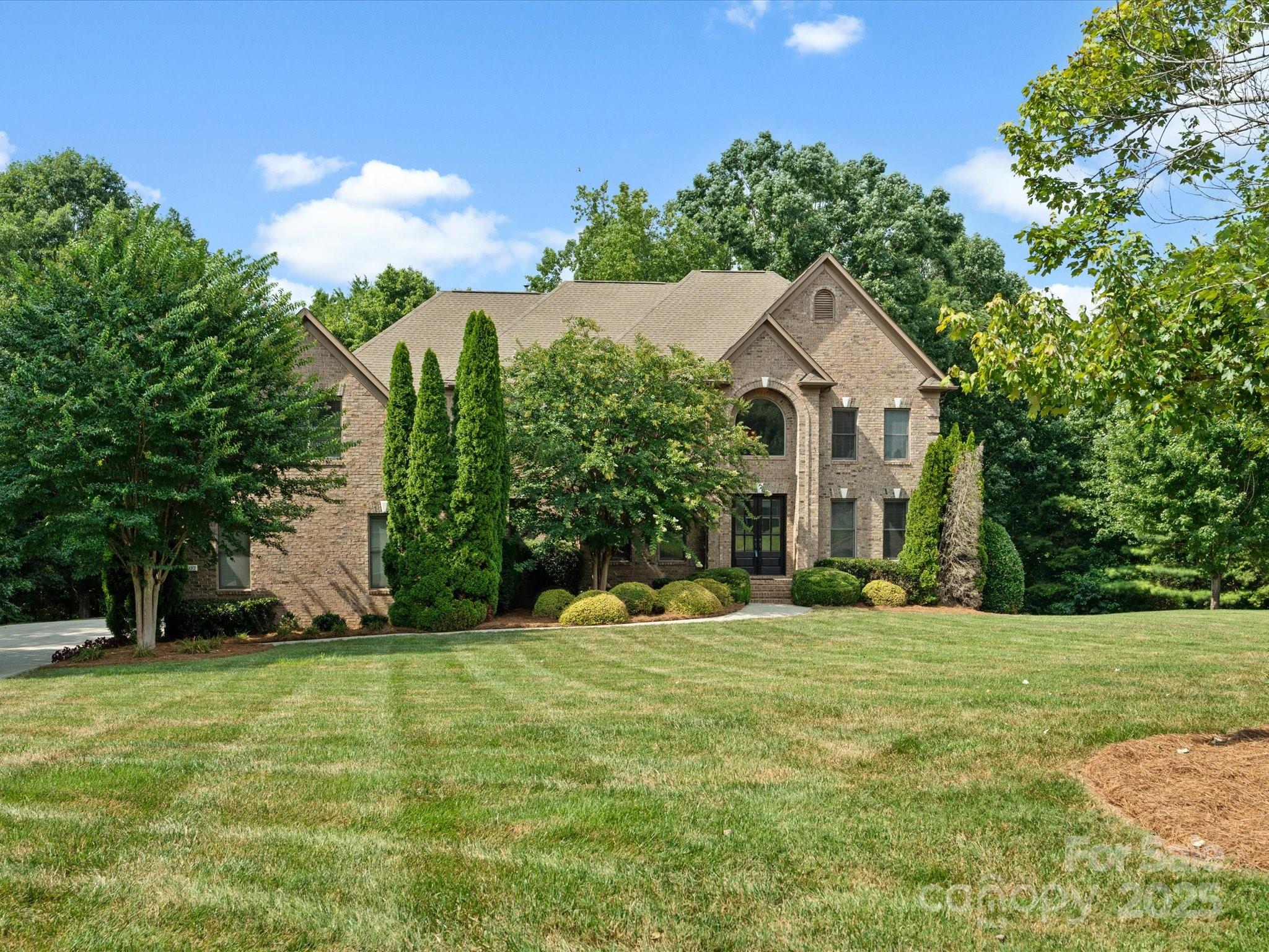 8407 Rolling Fields Road Mint Hill, NC 28227 - Photo 1 of 48 a front view of a house with a yard