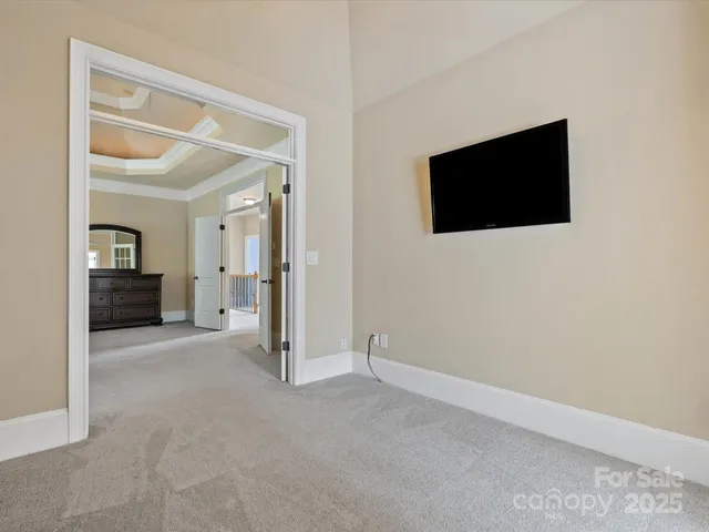 a view of a livingroom with an empty space and a flat screen tv