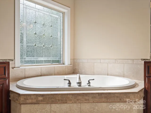 a bath tub sitting next to a window