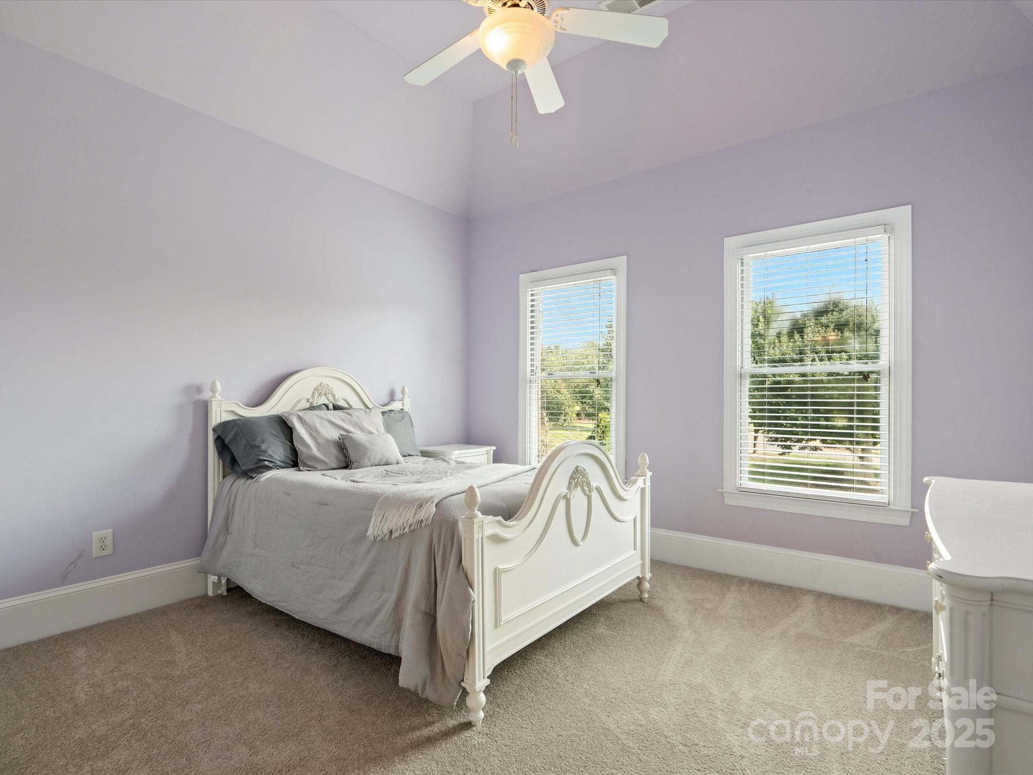 8407 Rolling Fields Road Mint Hill, NC 28227 - Photo 24 of 48 a bed sitting in a bedroom next to a window