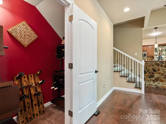 a view of hallway with stairs and a couch