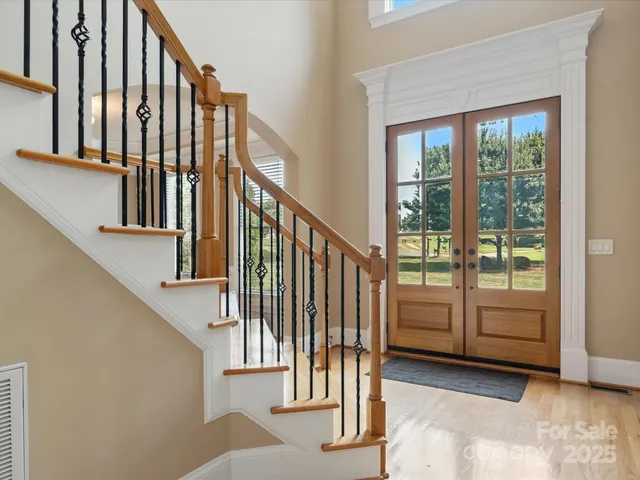 a view of staircase with lots of windows and door