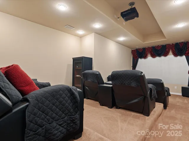 a living room with furniture a ceiling fan and a rug