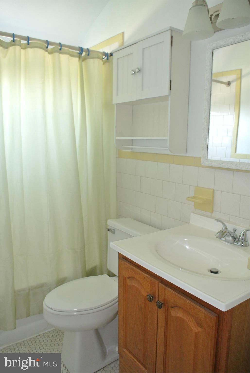 2700 Moorgate Road Baltimore, MD 21222 - Photo 7 of 27 a bathroom with a sink a toilet and shower