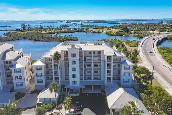 an aerial view of a house with a lake view