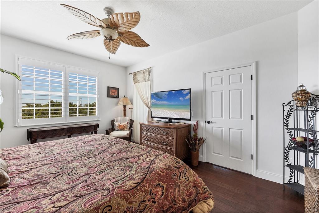 13113 Gasparilla Road, Unit A305 Placida, FL 33946 - Photo 12 of 29 a bedroom with a bed and a television