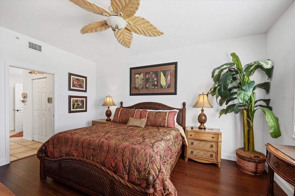 13113 Gasparilla Road, Unit A305 Placida, FL 33946 - Photo 14 of 29 a bedroom with a bed potted plant and a window