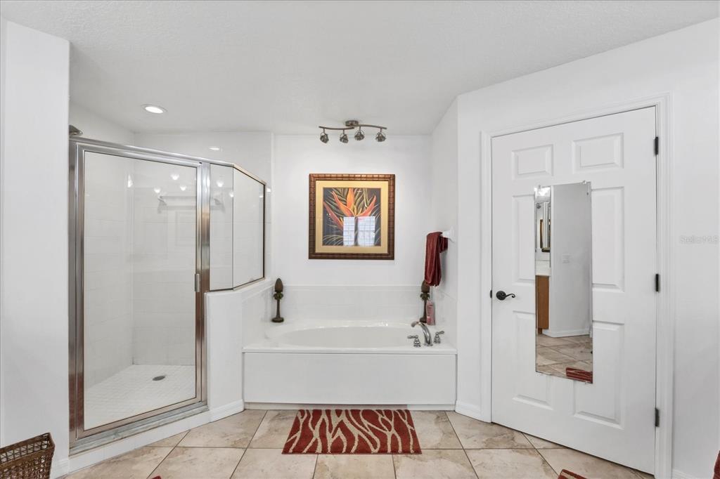 13113 Gasparilla Road, Unit A305 Placida, FL 33946 - Photo 15 of 29 a bathroom with a bathtub and a shower
