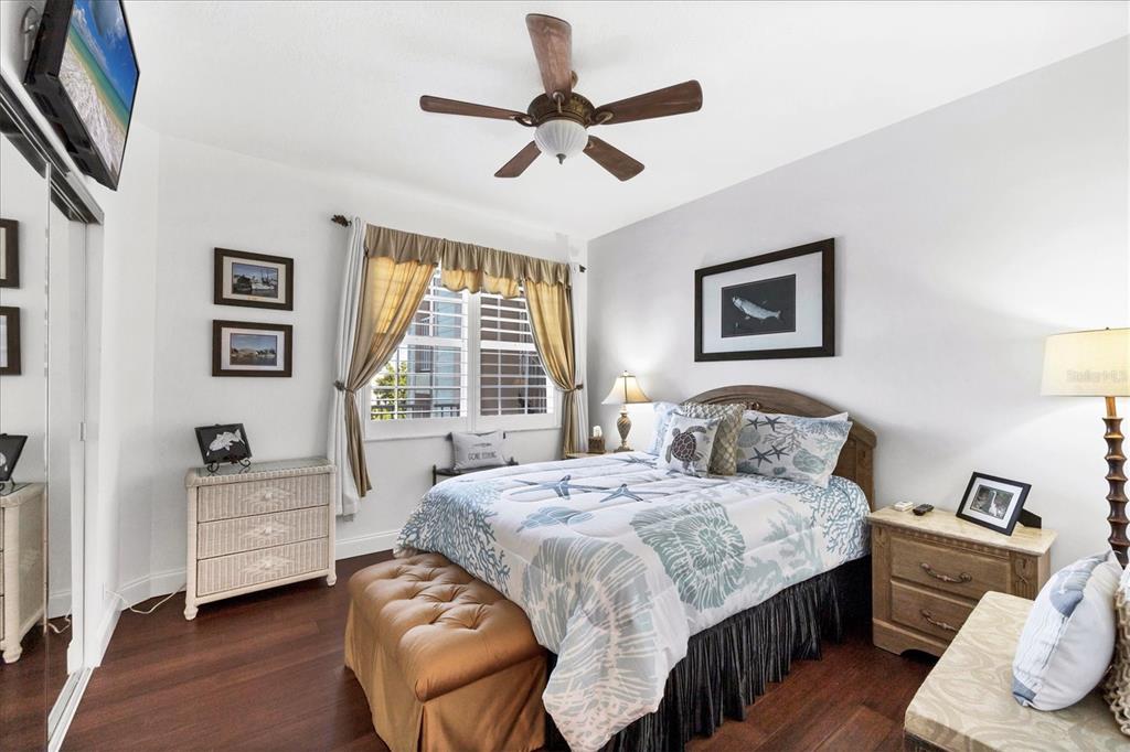 13113 Gasparilla Road, Unit A305 Placida, FL 33946 - Photo 18 of 29 a bedroom with a bed and a window