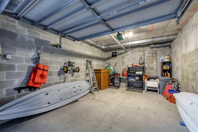 a view of a dining room with furniture and a chandelier fan