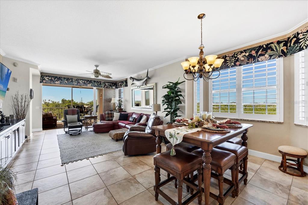 13113 Gasparilla Road, Unit A305 Placida, FL 33946 - Photo 6 of 29 a living room with furniture and a chandelier