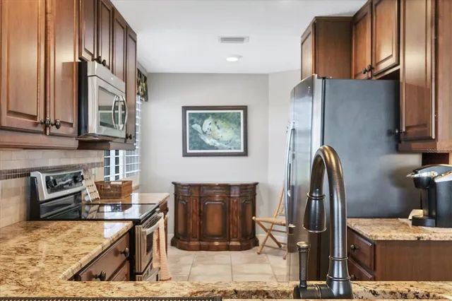 a view of a livingroom with furniture and windows