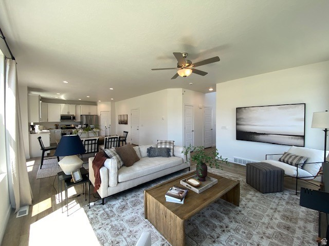 341 Quartz Road, Unit 8037 Tooele, UT 84074 - Photo 8 of 10 Open-concept living space featuring wood-finish flooring, recessed lighting, and a ceiling fan