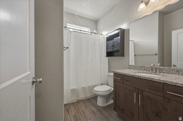 45 Memory Lane Tooele, UT 84074 - Photo 14 of 30 Full bathroom featuring vanity, light wood-style floors, and shower / bath combination