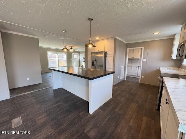 313 Salem Road McMinnville, TN 37110 - Photo 13 of 52 a kitchen with stainless steel appliances granite countertop a stove and wooden floor