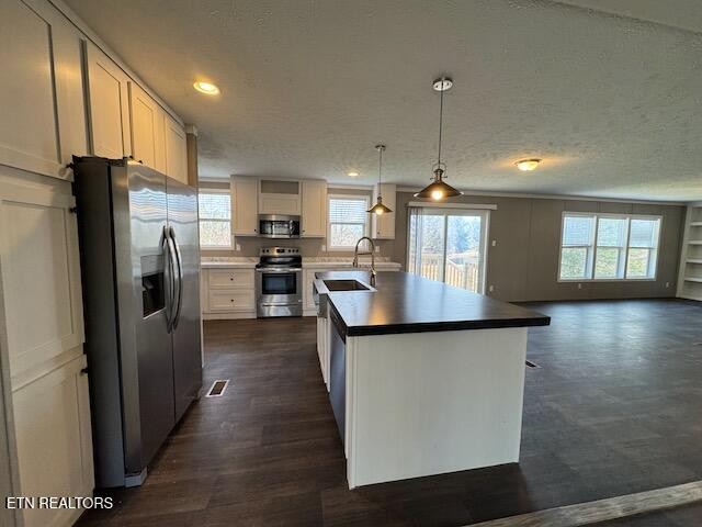 313 Salem Road McMinnville, TN 37110 - Photo 14 of 52 a kitchen with stainless steel appliances granite countertop a refrigerator a stove and a sink