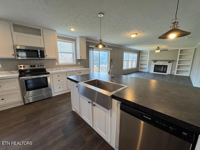 313 Salem Road McMinnville, TN 37110 - Photo 2 of 52 a kitchen with stainless steel appliances granite countertop a sink a stove and a wooden floors