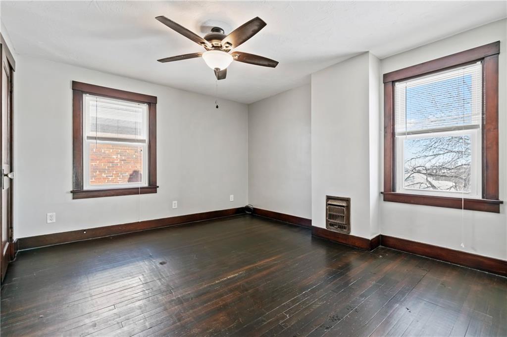 3409 Brownsville Road Pittsburgh, PA 15227 - Photo 15 of 28 an empty room with wooden floor and windows