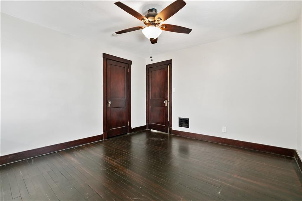 3409 Brownsville Road Pittsburgh, PA 15227 - Photo 21 of 28 a view of an empty room with wooden floor