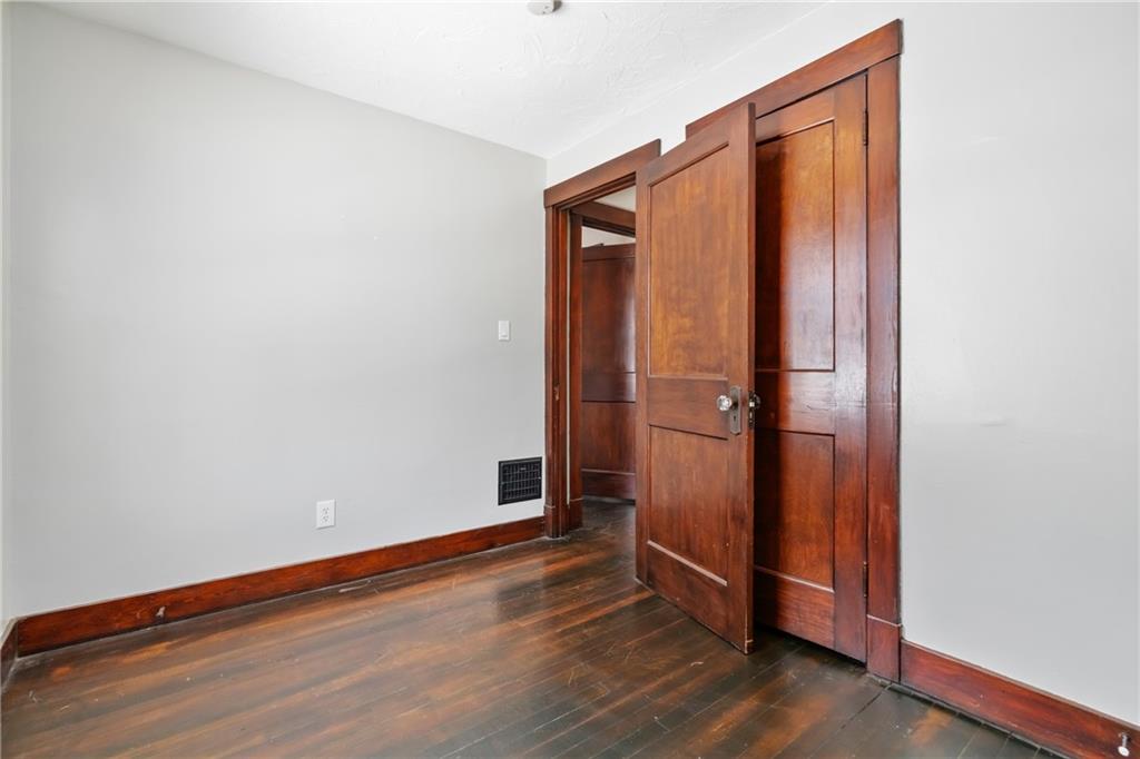 3409 Brownsville Road Pittsburgh, PA 15227 - Photo 23 of 28 an empty room with wooden floor