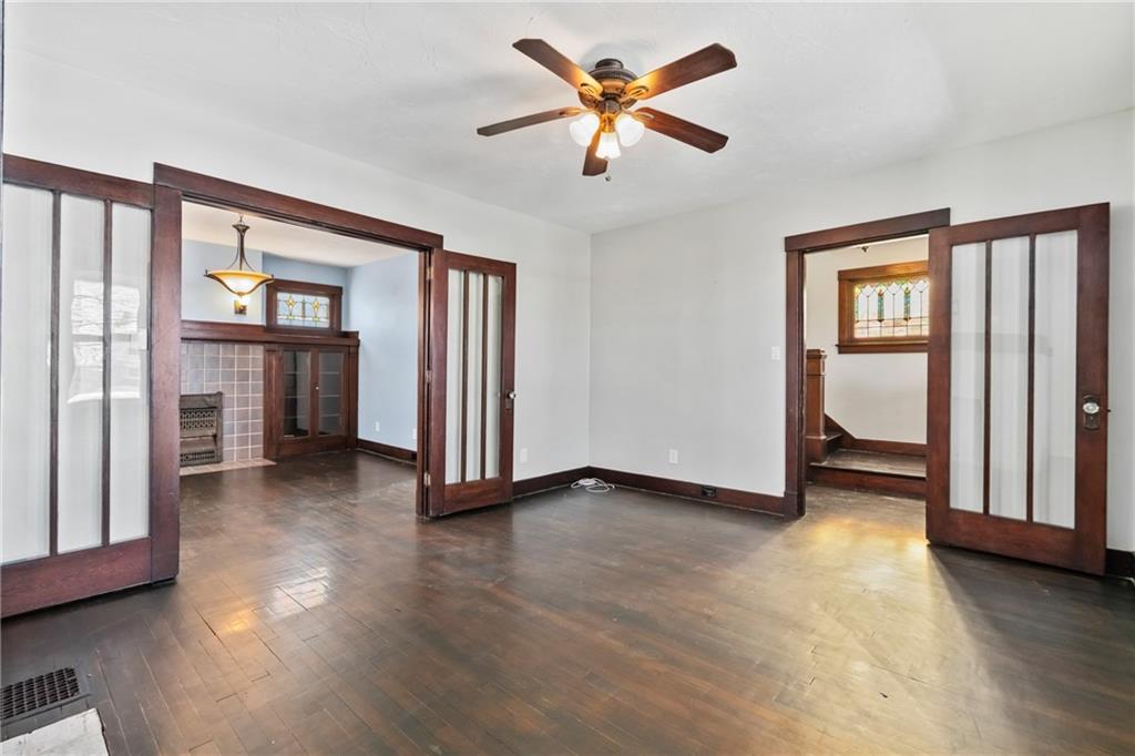 3409 Brownsville Road Pittsburgh, PA 15227 - Photo 7 of 28 wooden floor in an empty room with a window