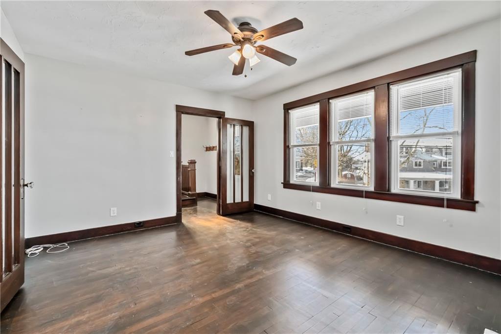 3409 Brownsville Road Pittsburgh, PA 15227 - Photo 8 of 28 wooden floor in an empty room with a window