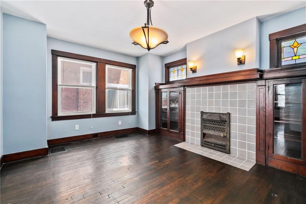 3409 Brownsville Road Pittsburgh, PA 15227 - Photo 10 of 28 a view of an empty room with wooden floor and a window