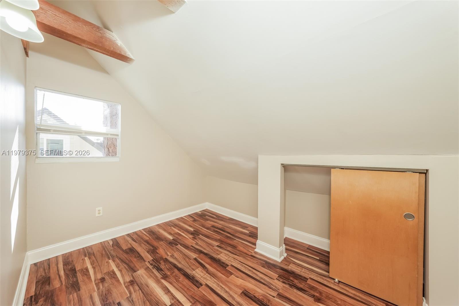 5227 Adams Road Delray Beach, FL 33484 - Photo 12 of 18 a view of a room with wooden floor and bedroom