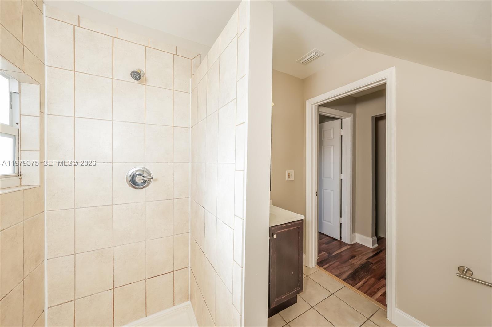 5227 Adams Road Delray Beach, FL 33484 - Photo 15 of 18 a bathroom with a shower and a sink
