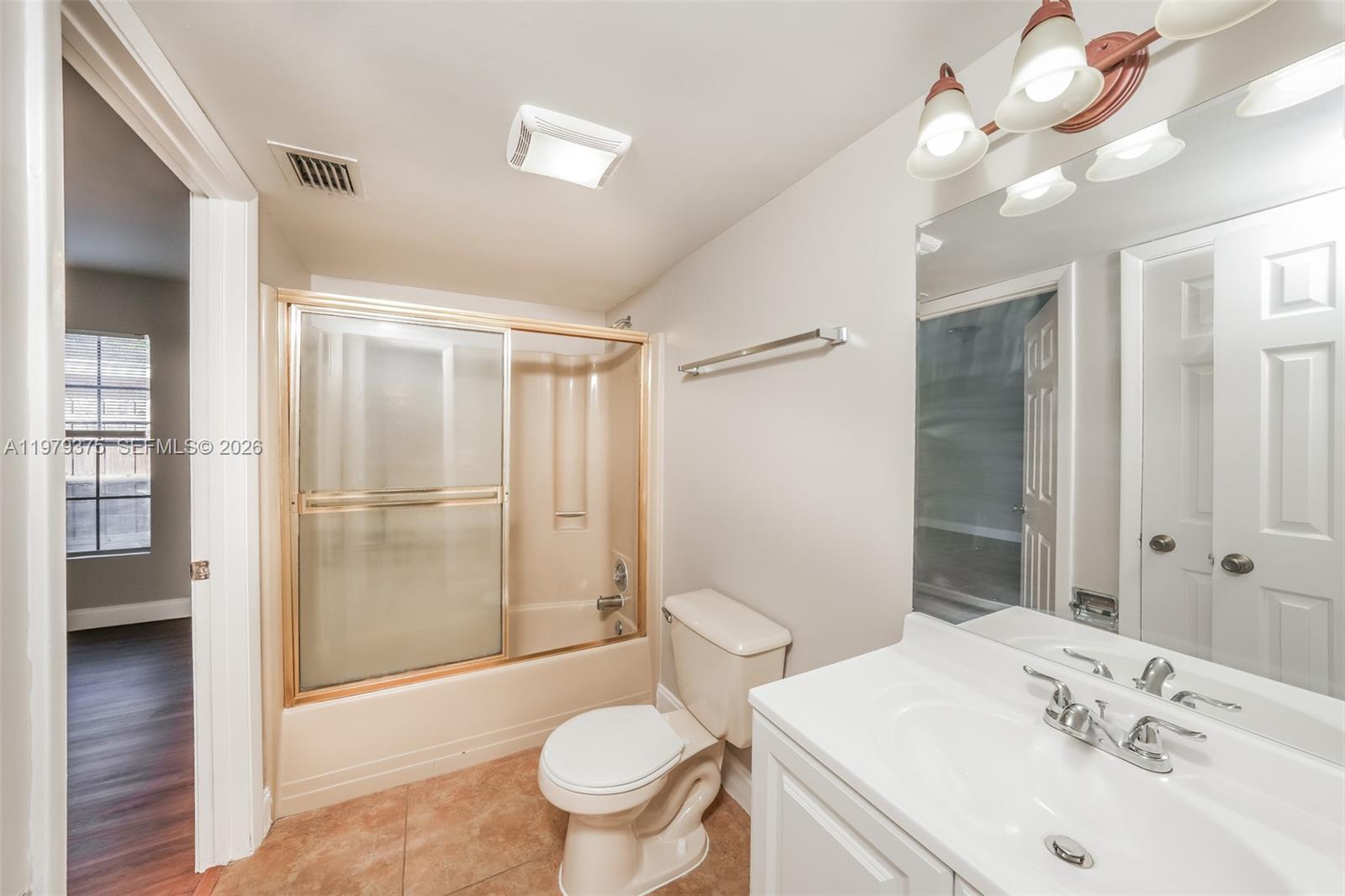 5227 Adams Road Delray Beach, FL 33484 - Photo 17 of 18 a bathroom with a sink toilet and shower