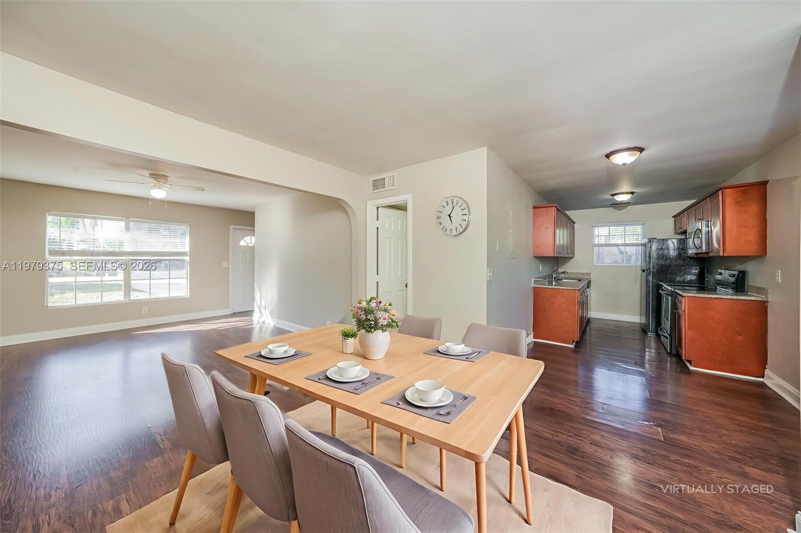 5227 Adams Road Delray Beach, FL 33484 - Photo 7 of 18 a view of a dining room with furniture and wooden floor