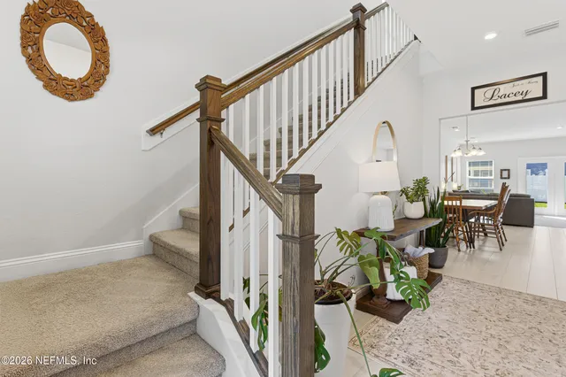 a bedroom with bed and dresser