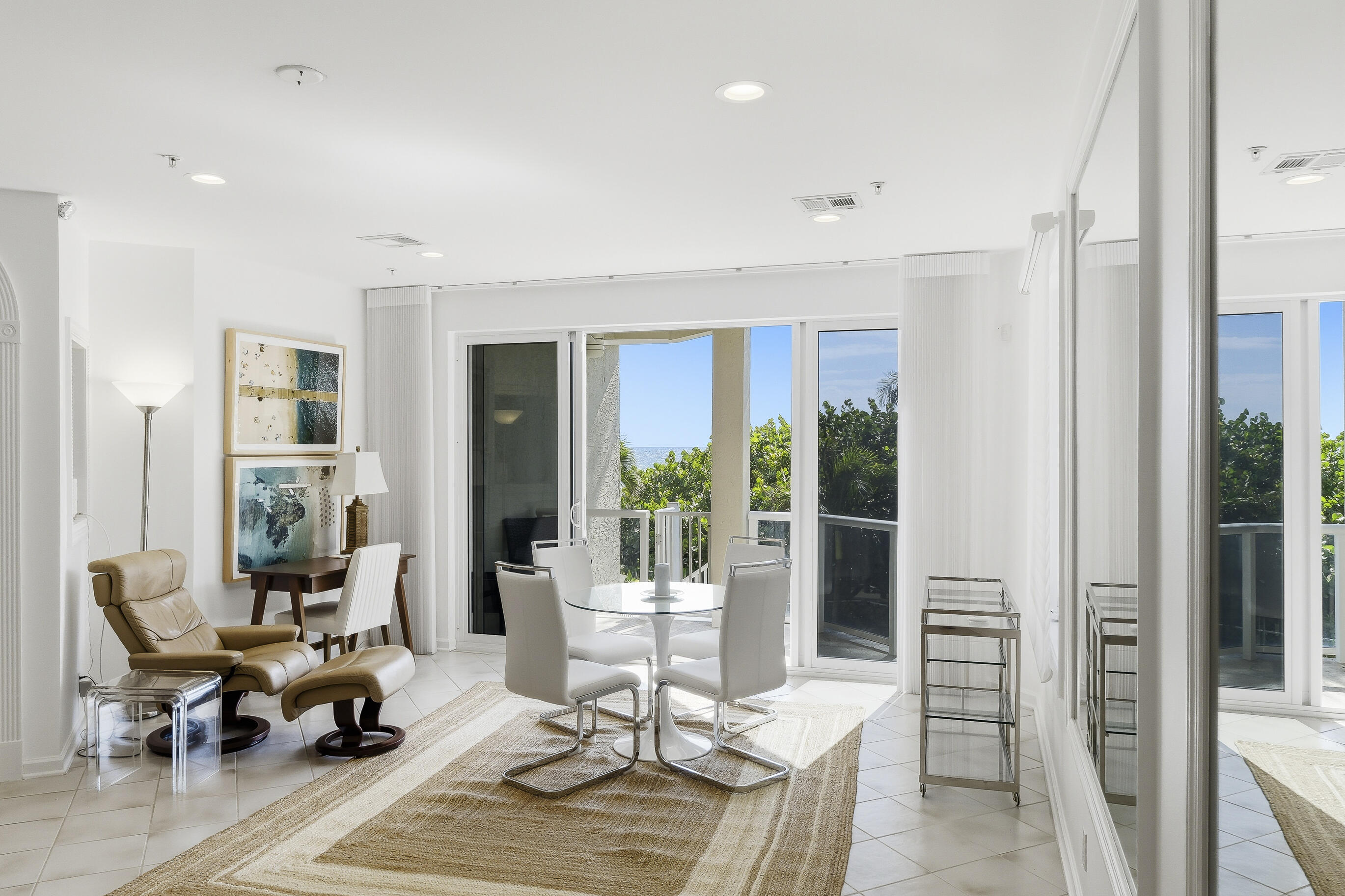 4535 Coquina Road Ocean Ridge, FL 33435 - Photo 11 of 45 a living room with furniture large window and dining table