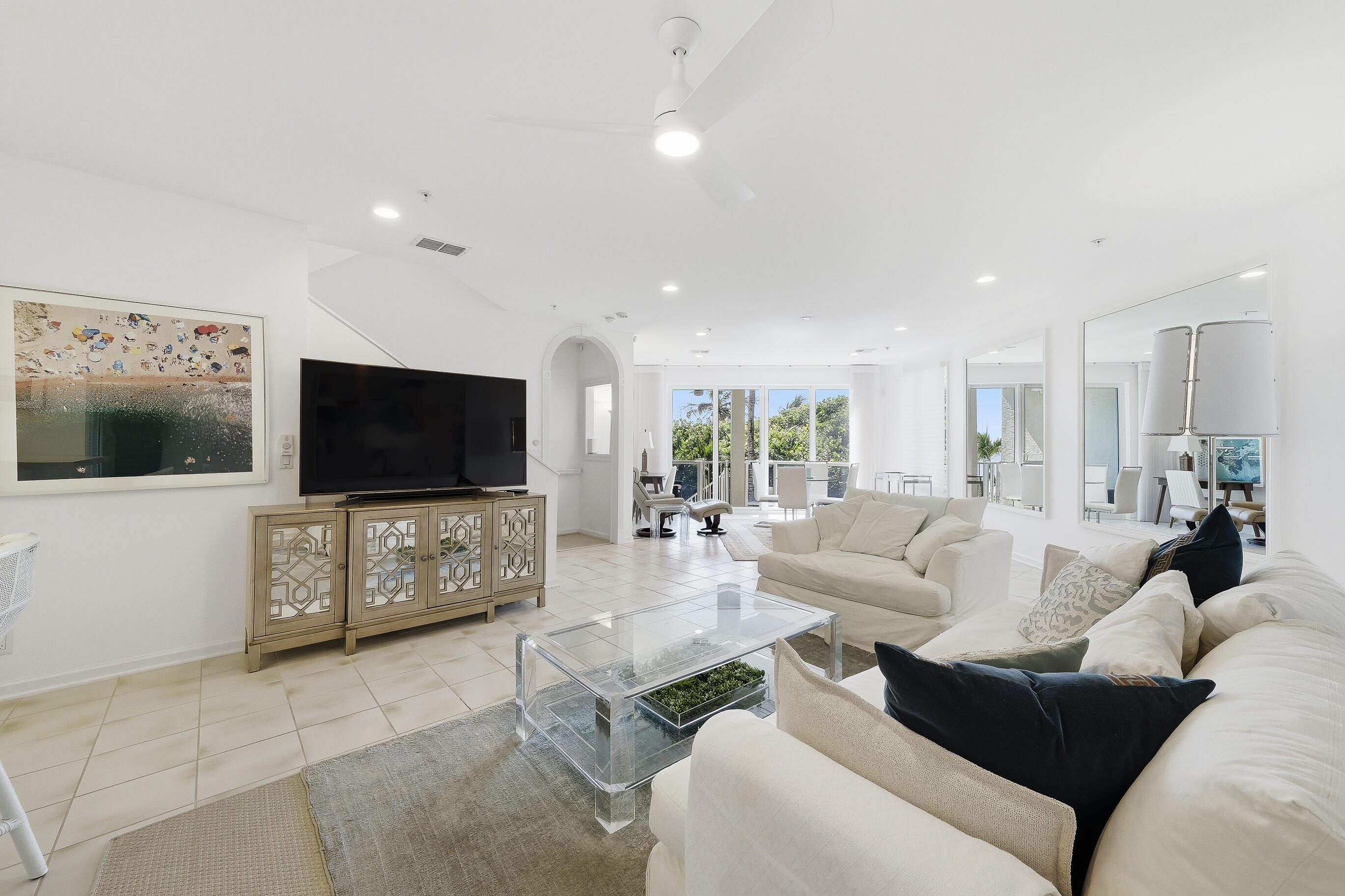 4535 Coquina Road Ocean Ridge, FL 33435 - Photo 15 of 45 a living room with furniture and a flat screen tv