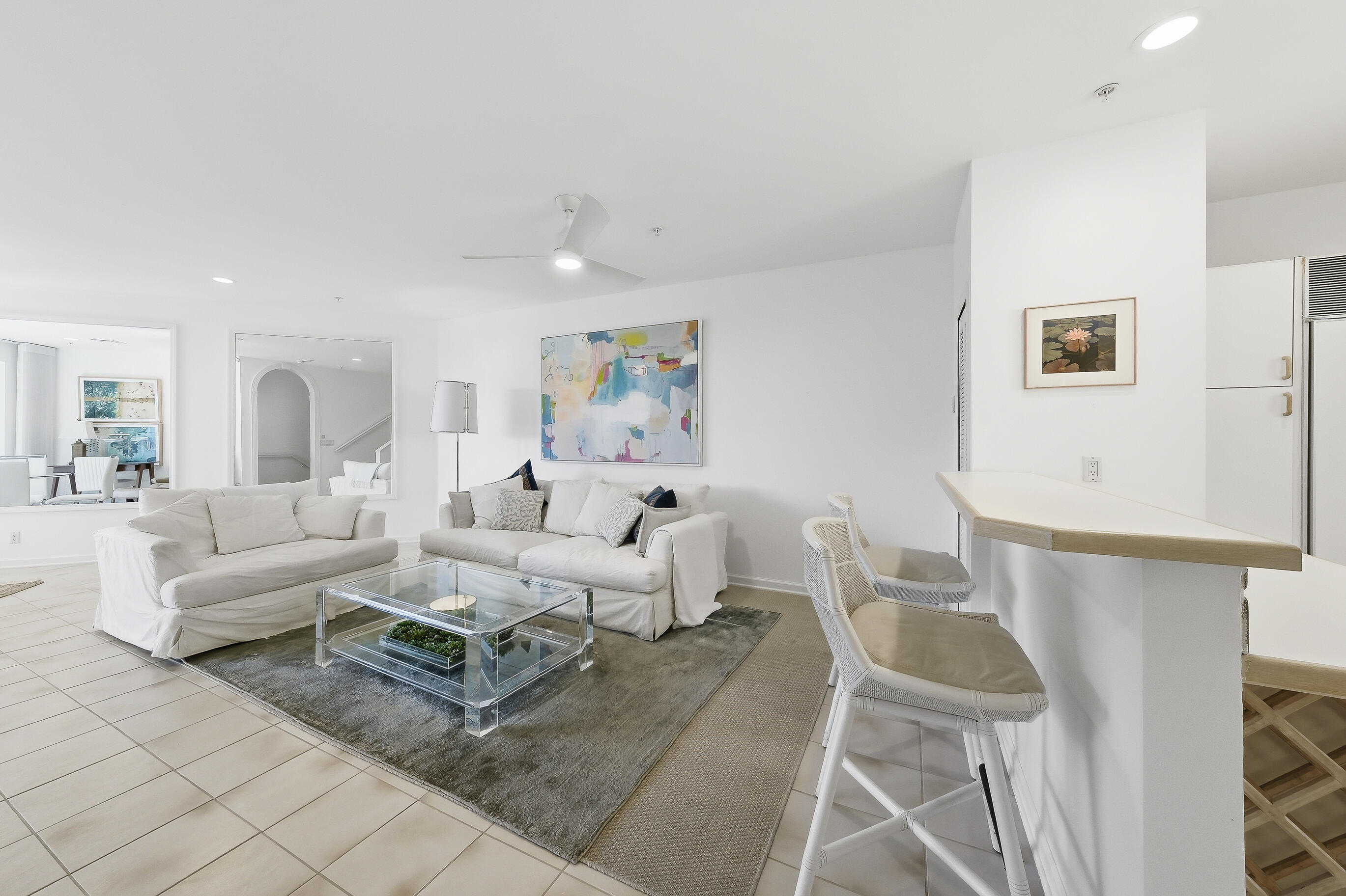 4535 Coquina Road Ocean Ridge, FL 33435 - Photo 16 of 45 a living room with furniture and a painting on the wall