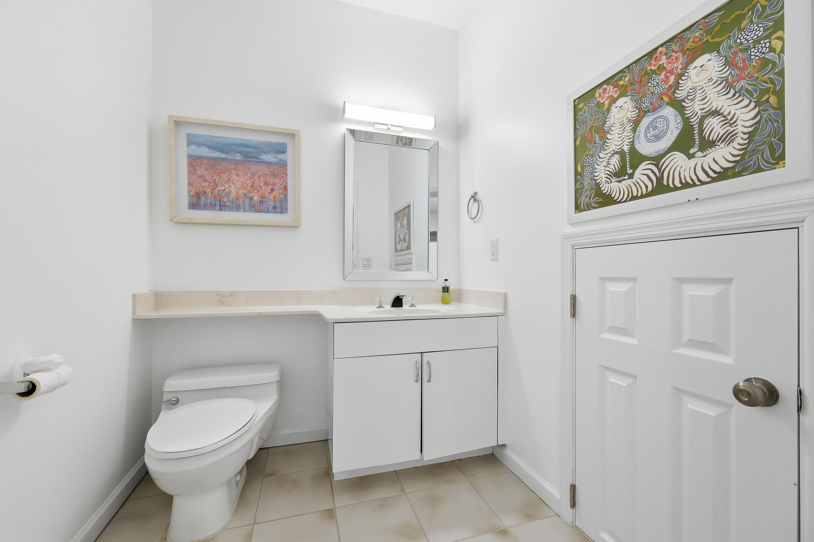 4535 Coquina Road Ocean Ridge, FL 33435 - Photo 20 of 45 a bathroom with a toilet a sink and mirror