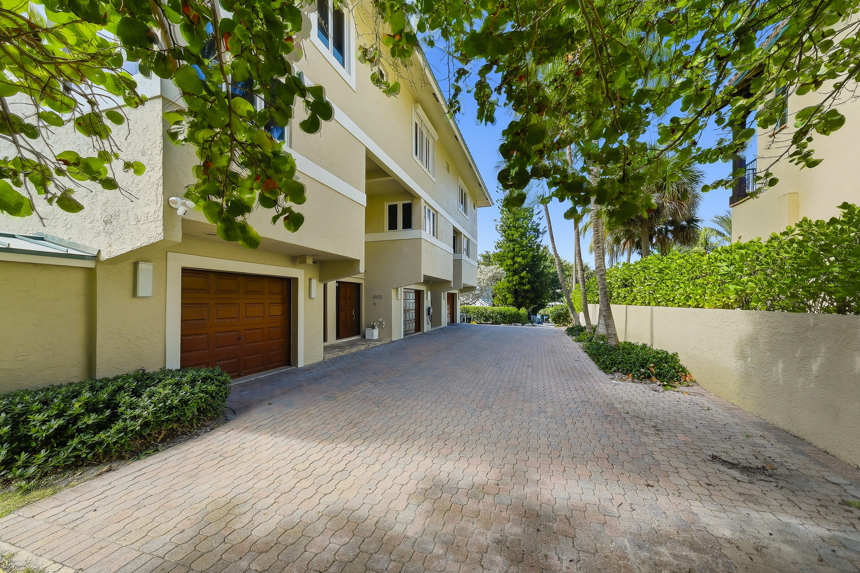 4535 Coquina Road Ocean Ridge, FL 33435 - Photo 2 of 45 a front view of a house with a yard and garage