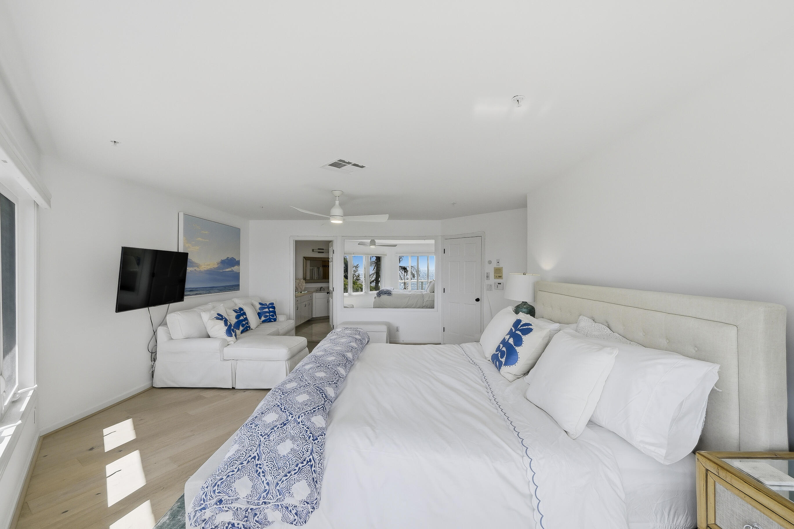 4535 Coquina Road Ocean Ridge, FL 33435 - Photo 28 of 45 a bedroom with a bed and a flat screen tv