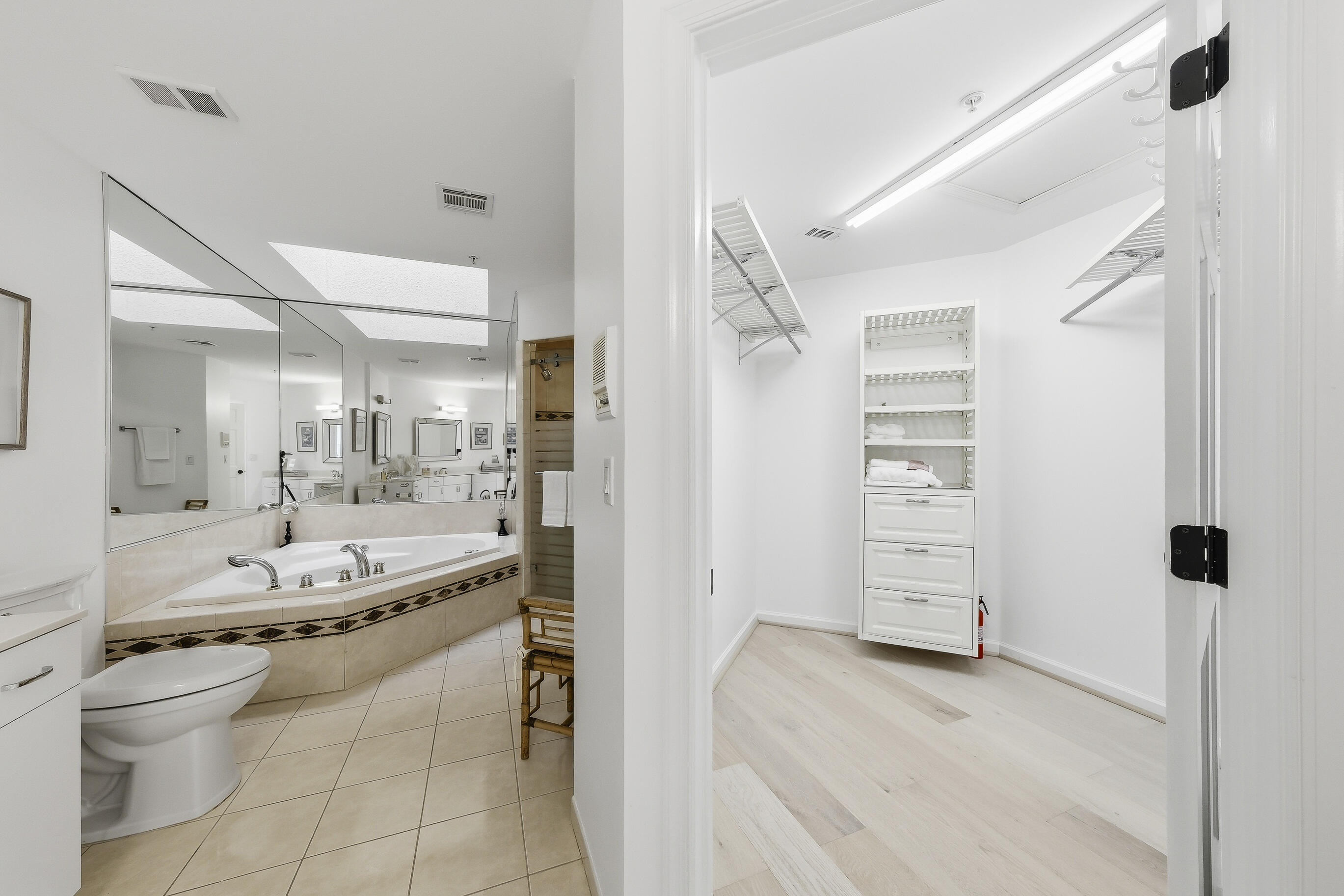 4535 Coquina Road Ocean Ridge, FL 33435 - Photo 32 of 45 a bathroom with a granite countertop sink a toilet and shower