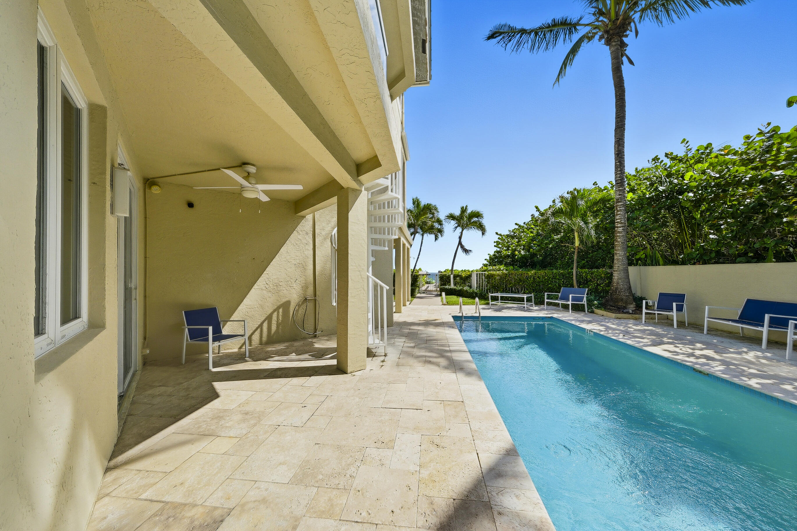 4535 Coquina Road Ocean Ridge, FL 33435 - Photo 35 of 45 a view of a swimming pool with a patio